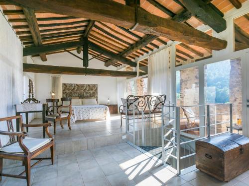 a living room with a bed and a table and chairs at Apartment Torre 4 by Interhome in Stigliano