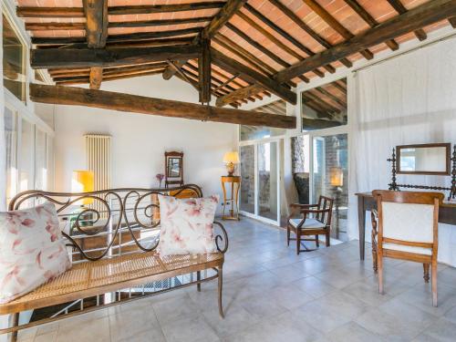 a living room with a bench and a table at Apartment Torre 4 by Interhome in Stigliano