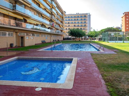 a swimming pool in the middle of a building at Apartment Colom by Interhome in Malgrat de Mar