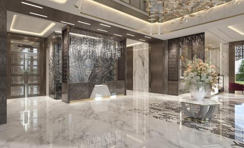 a lobby with a table and a vase of flowers at Fortune Park, Aligarh - Member ITC Hotels' Group in Alīgarh
