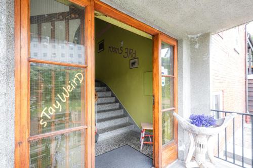 an open door of a building with a staircase at Tiglkåk in Åndalsnes