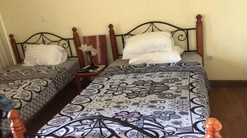 Ένα ή περισσότερα κρεβάτια σε δωμάτιο στο San Stefano Grand Plaza