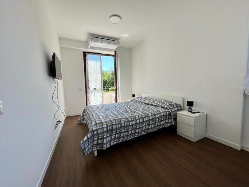 Posteľ alebo postele v izbe v ubytovaní Kibilù - Malpensa Airport - Easy check-in and check-out