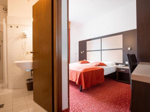 Postel nebo postele na pokoji v ubytování Hotel Benacus Panoramic