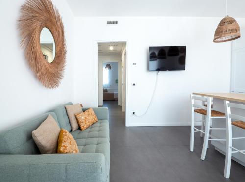 a living room with a couch and a table at Casa al Mare 10 in Fano