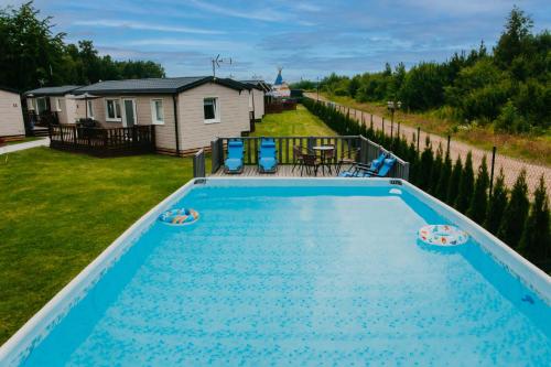 an overhead view of a swimming pool in a yard at LUXURY CAMP - 150 m od Suntago Park in Grabce-Towarzystwo