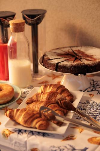a table with some bread and a plate of food at Orizzonte Mare Panoramic Rooms in Agropoli