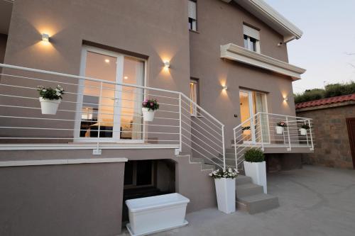 a house with a toilet on the side of it at Orizzonte Mare Panoramic Rooms in Agropoli