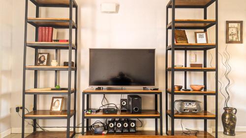 a flat screen tv sitting on top of a shelf at BELGRANO 124 - CORRIENTES in Corrientes