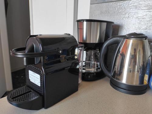 a black mixer sitting on top of a counter at Anatoli House in Gaios