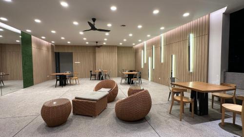 a restaurant with tables and chairs and tables and tablesktop at Panoramic KL View @Robertson Bukit Bintang 40f in Kuala Lumpur