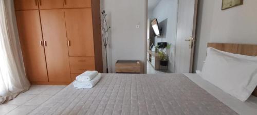 Postel nebo postele na pokoji v ubytování Comfy apartment near the port and the center of Volos