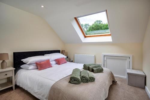 a bedroom with a bed with towels on it at Finest Retreats - Victory Mill - Apartment Five in Pickering