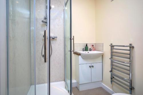 a bathroom with a shower and a sink at Finest Retreats - Victory Mill - Apartment Five in Pickering