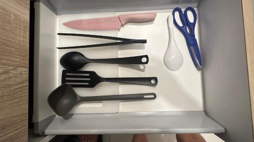 a drawer filled with utensils in a box at Panoramic KL View @Robertson Bukit Bintang 40f in Kuala Lumpur