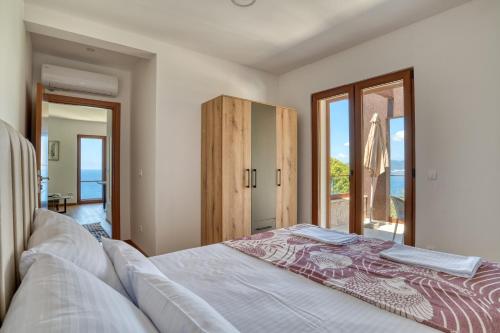 Ένα ή περισσότερα κρεβάτια σε δωμάτιο στο Vila Aria vista