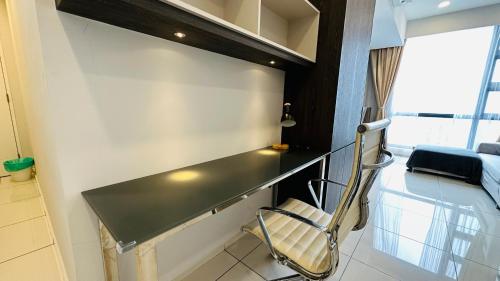 a room with a desk and a chair in a room at Panoramic KL View @Robertson Bukit Bintang 40f in Kuala Lumpur
