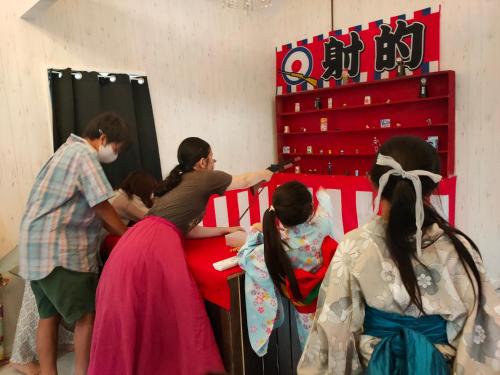 a group of people standing around a bed at Kominka Wagaya in Higashi-osaka