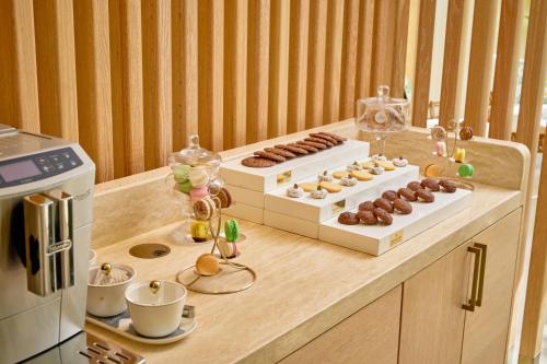a kitchen with two boxes of donuts on a counter at Palmyard Hotel in Manama