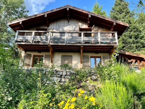 an old house on a hill with trees at Chalet la parenthèse in Le Tholy