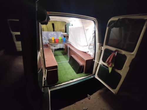 a view of the inside of a van with a table at canary van for drive, near to TFS Mercedes MB130 in Adeje
