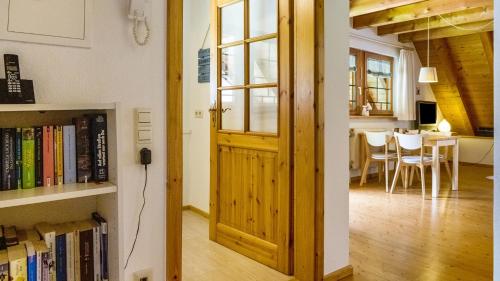 a room with a door and a dining room with a table at Haus Miriam in Münstertal