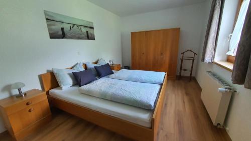 Un pat sau paturi într-o cameră la Haus Habit