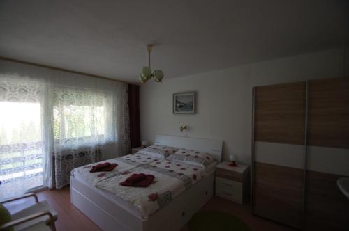 Postel nebo postele na pokoji v ubytování Apartments Mencinger
