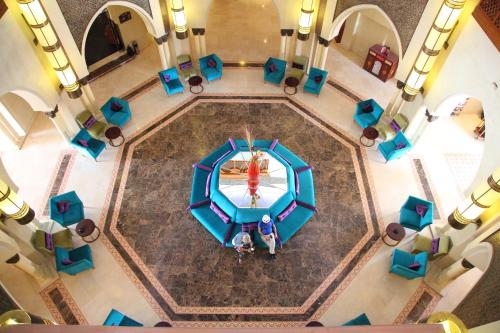 an overhead view of a table and chairs in a building at Palm Plaza Marrakech in Marrakech