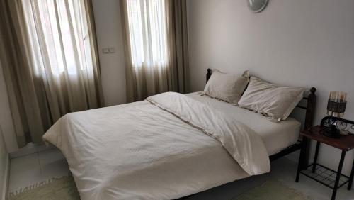 Ліжко або ліжка в номері Maison Sidi bouzid