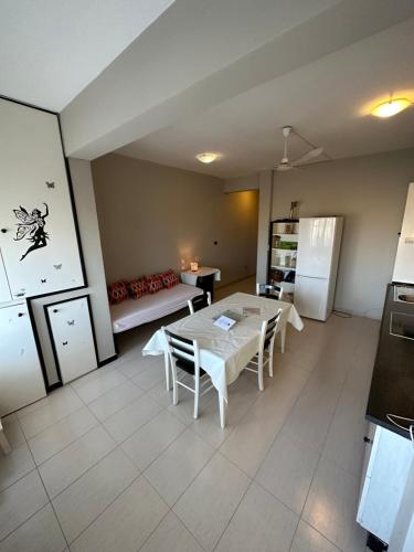 a kitchen with a table and chairs in a room at sea View Nautilus free wi-fi Sal Rei in Sal Rei