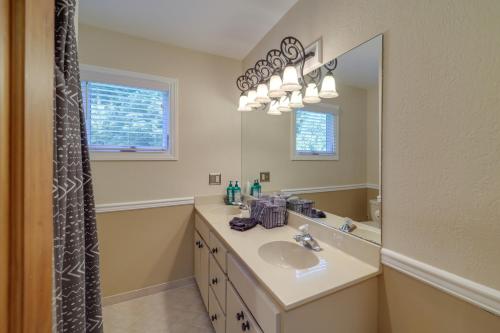 a bathroom with a sink and a mirror at 7 Mi to Beech Mountain Skiing Home with Fire Pit in Banner Elk