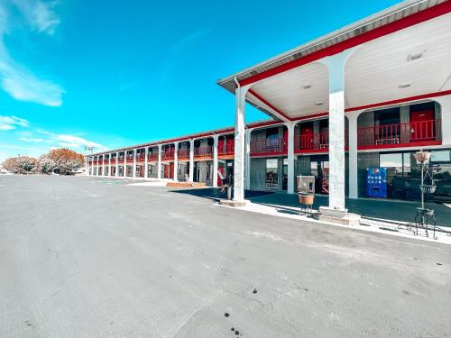 an empty parking lot in front of a building at Laker Inn in Jamestown
