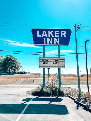 a sign for a larger inn on the side of a road at Laker Inn in Jamestown