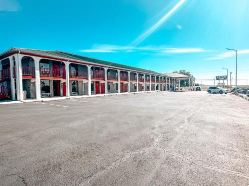 an empty parking lot in front of a building at Laker Inn in Jamestown