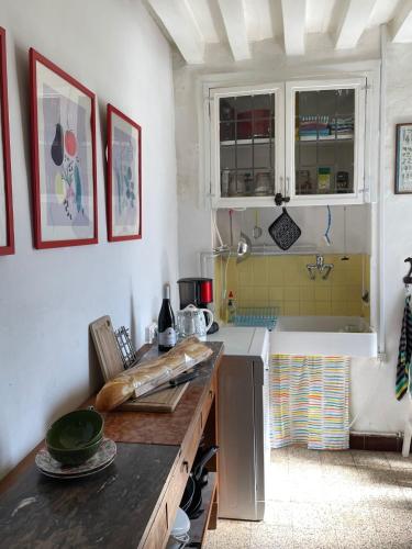 a kitchen with a counter and a sink and a counter top at Maison Lavande in Blismes