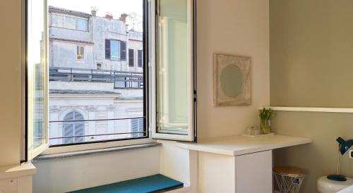 a bathroom with a window with a view of a building at NTB Roma in Rome