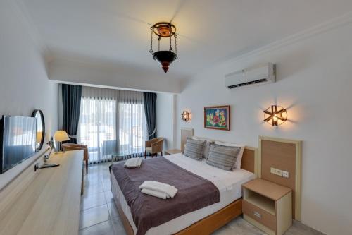 Postel nebo postele na pokoji v ubytování Sami Beach Hotel- All Inclusive