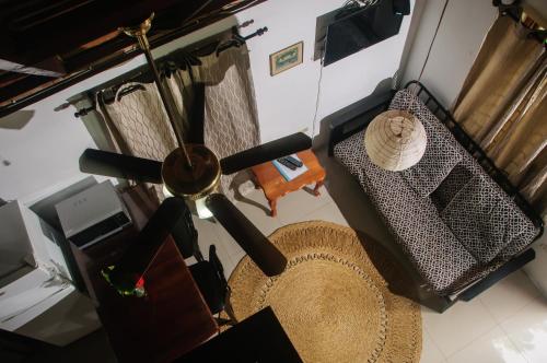 an overhead view of a living room with a ceiling fan at Firefly Beach Cottages in Negril
