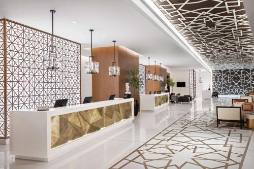 a lobby of a hotel with a reception desk at Doubletree By Hilton Jabal Omar Makkah in Makkah