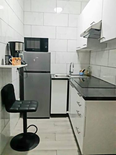 Una cocina o kitchenette en Apartment and free parking place
