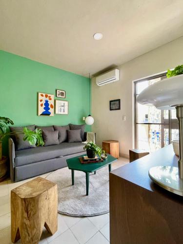 a living room with a couch and a table at Casa San Fernando by Barrio México in Guadalajara