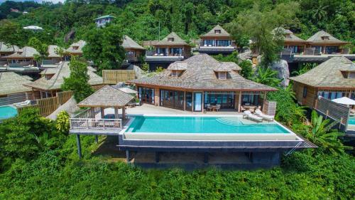 an aerial view of a house with a swimming pool at Hilton Seychelles Northolme Resort & Spa in Beau Vallon