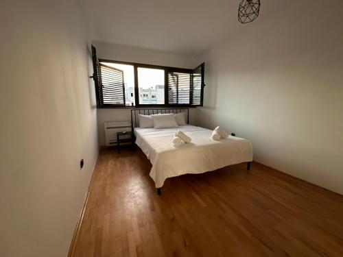 Кровать или кровати в номере City Oasis - two bedroom apartment in Blok 5