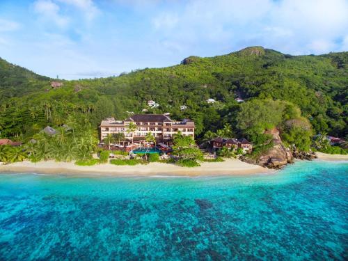 an aerial view of a resort on a beach at DoubleTree by Hilton Seychelles Allamanda Resort & Spa in Takamaka