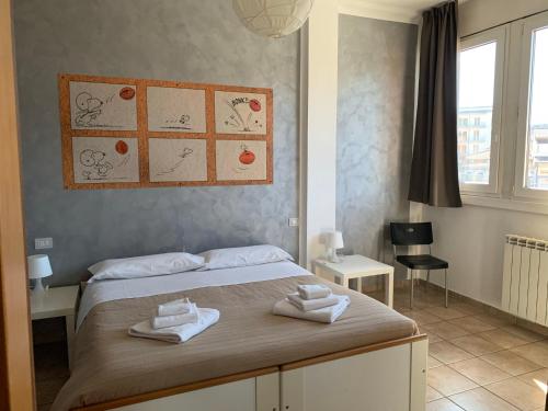 Postel nebo postele na pokoji v ubytování La Chiocciola Guesthouse Briantea