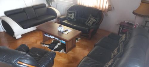 an overhead view of a living room with a couch and a table at Vranje City Center, Penthouse Delux Apartment in Vranje
