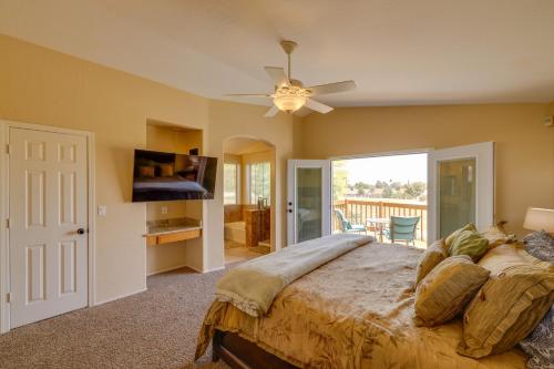 a bedroom with a bed and a flat screen tv at Stunning Phoenix Oasis with Golf Course Views! in Phoenix