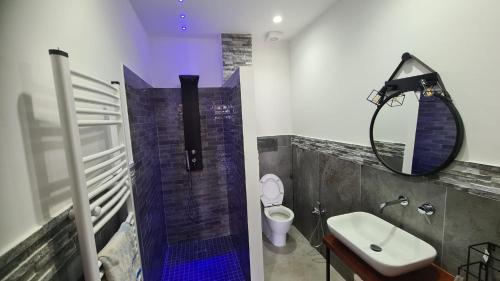 a bathroom with a shower and a sink and a mirror at CASA VENEZIANO in Messina