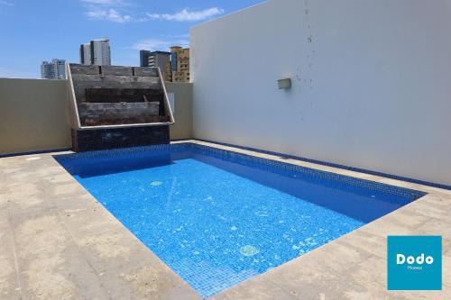 a swimming pool on the roof of a building at Torre con alberca a 1 cuadra de la playa in Mazatlán